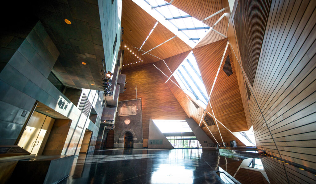 Large modern empty room with angled walls and windows